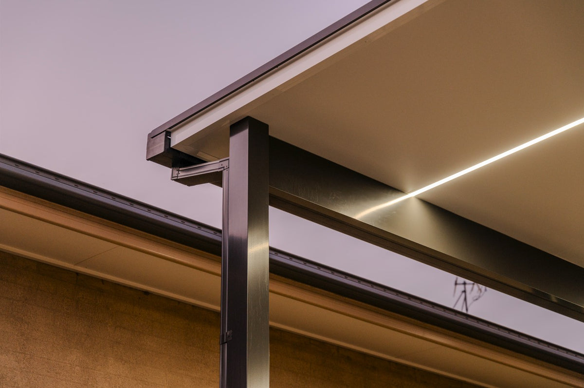 Close-up of attached patio post, beam and LED lighting