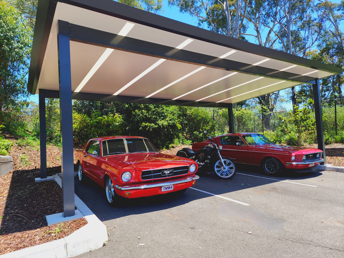 Freestanding patio structure with skylight panels over a car park