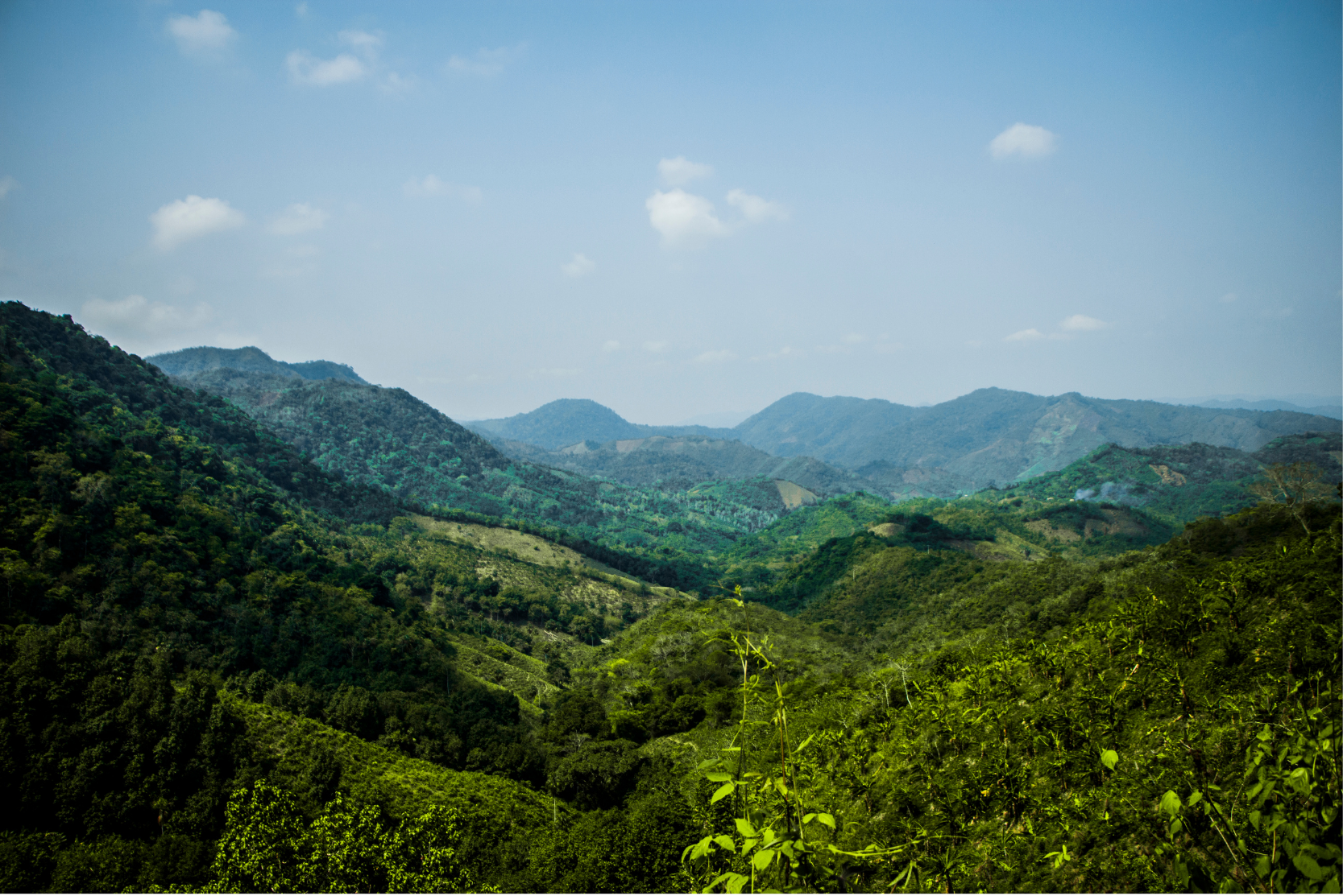 Green mountainous landscape with clear blue sky