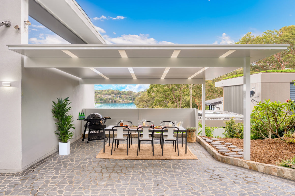 Attached patio over an outdoor dining area with water views