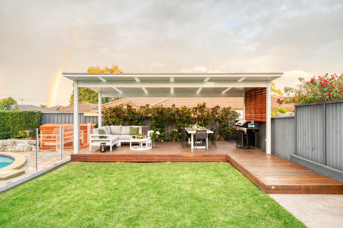 Freestanding patio over a timber deck and backyard lounge area